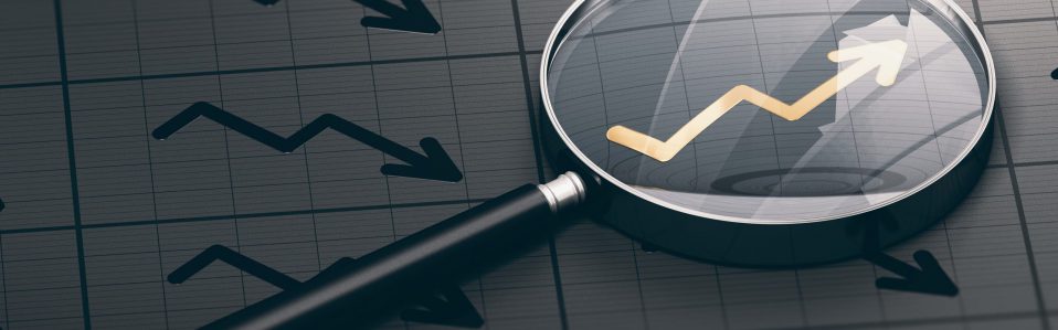 3D illustration of a magnifying glass over a golden positive chart symbol. Concept of investing opportunities and excellent investment.